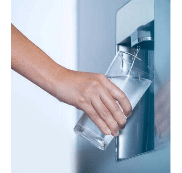 A person filling their glass with water from a chilled water dispenser