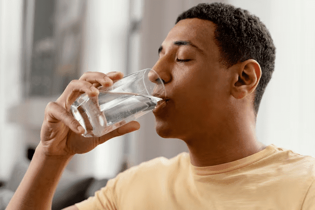 A man drinking clean water from a matrix tap