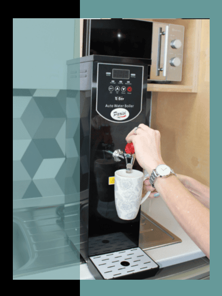 The Parisi E-Bev Boiling Water Dispenser in use in an office break area