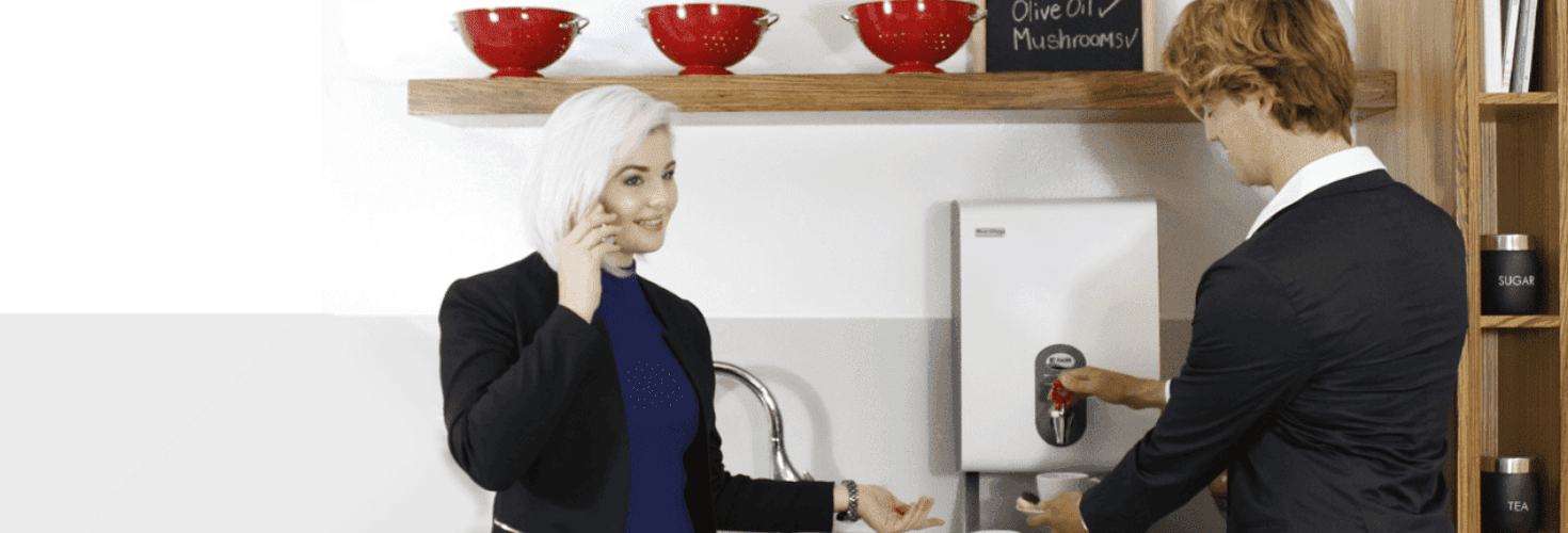 Team in an office making coffee with a he Hydroboil instant water dispenser