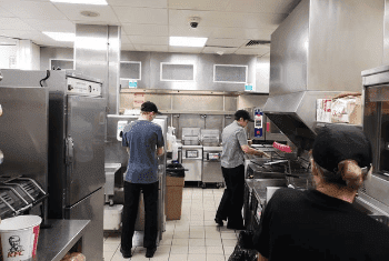 A kitchen using a gas geyser for all their hot water needs