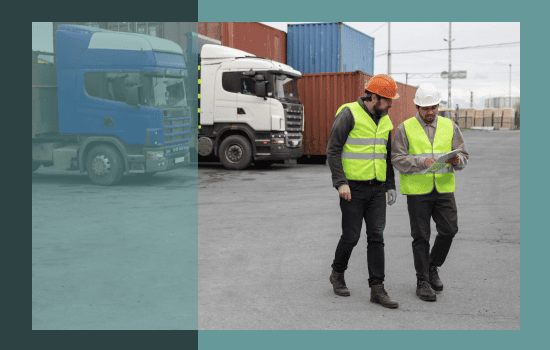 Two logistics employees walking through a distribution centre