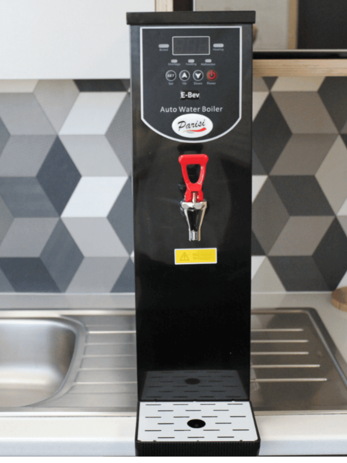 The Parisi E-Bev boiling water dispenser in an office kitchen