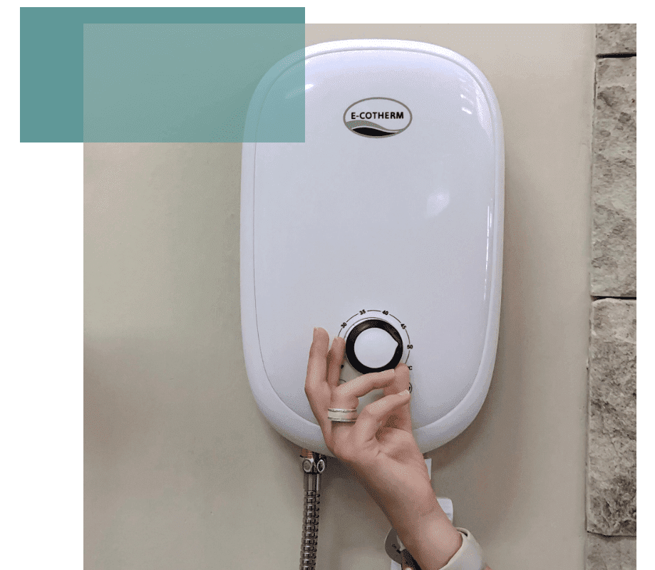 A woman adjusting the temperature of the e-cotherm instant water heater.