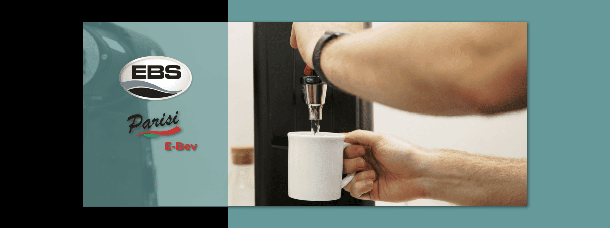 A barista pouring instant boiling water from the Parisi E-Bev dispenser