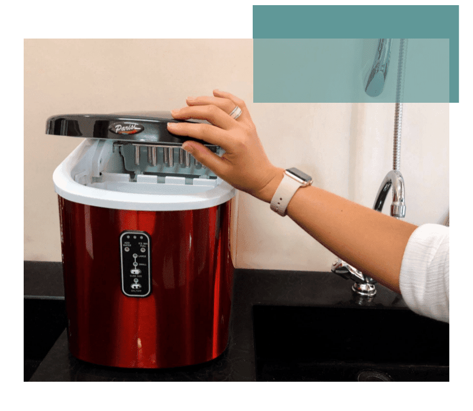 A woman getting ice from a Parisi ice making machine