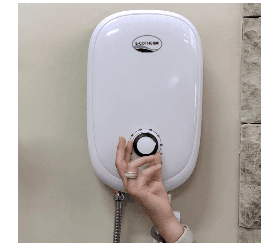 A woman adjusting the temperature of the e-cotherm instant water heater.