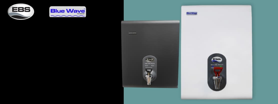 BlueWave wall-mounted boiling water dispenser installed in a guesthouse breakfast room in South Africa