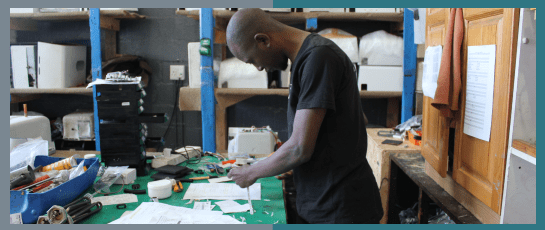 A man servicing a tankless water heater effortlessly