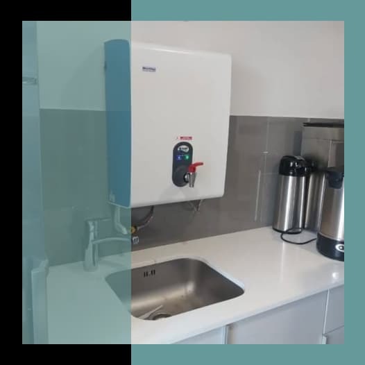 BlueWave wall-mounted boiling water dispenser above the sink in the office kitchen at Capitec Business, Sandton