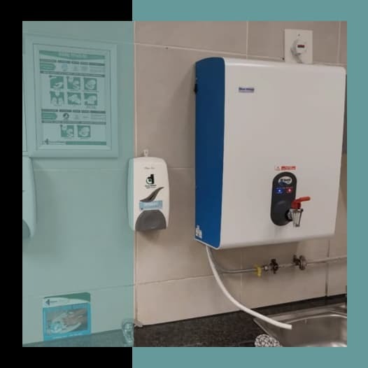 BlueWave wall-mounted boiling water dispenser installed above the sink in the staff kitchen at Checkers New Menlyn