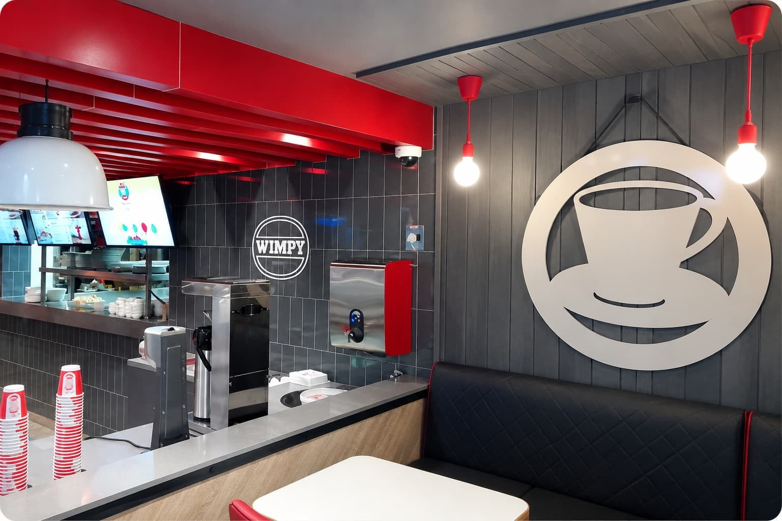 BlueWave boiling water dispenser installed at a Wimpy restaurant, showing the dispenser in the café service area.